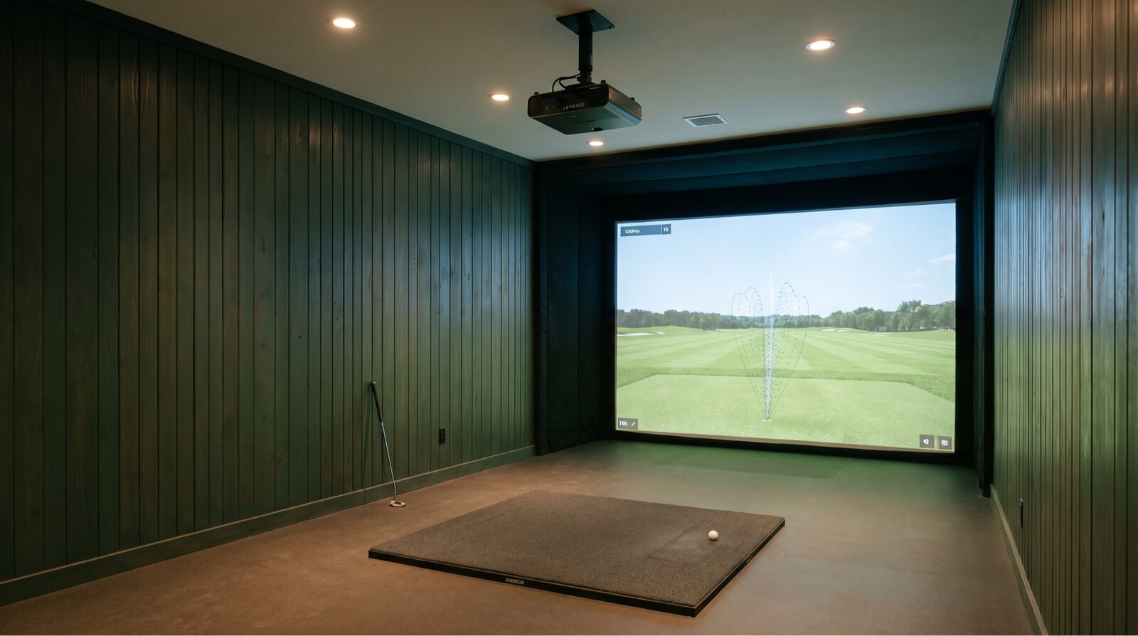 Simulator bay, hemlock walls, GSPro screen on the wall, Uneekor projector overhead.